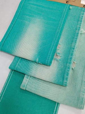 Buy Fancy APPLE GREEN Color Left Twill Style 10.6oz Denim Fabric With 10*7 Construction For Jeans online manufacture